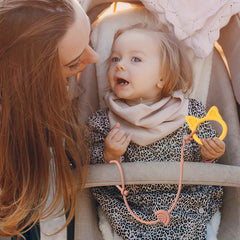 Andy Bear stroller-attachment keeps items secure on the go.