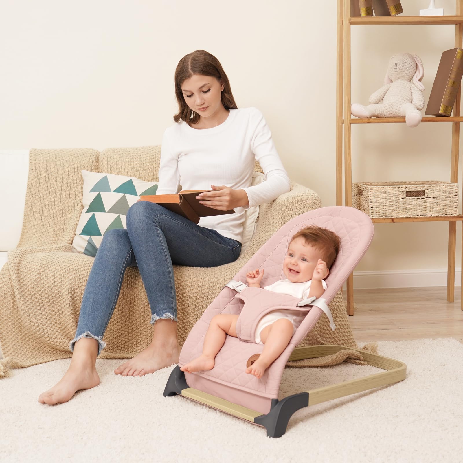 ANGELBLISS Baby Bouncer pink living room setup showing compact portability