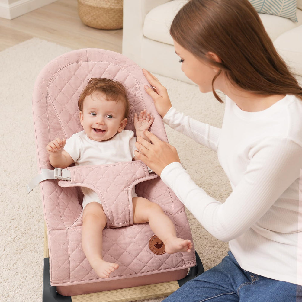 ANGELBLISS Baby Bouncer pink side view showing portable design for small spaces