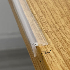 Angloria Edge Protector installed on wooden corner demonstrates discreet protection.