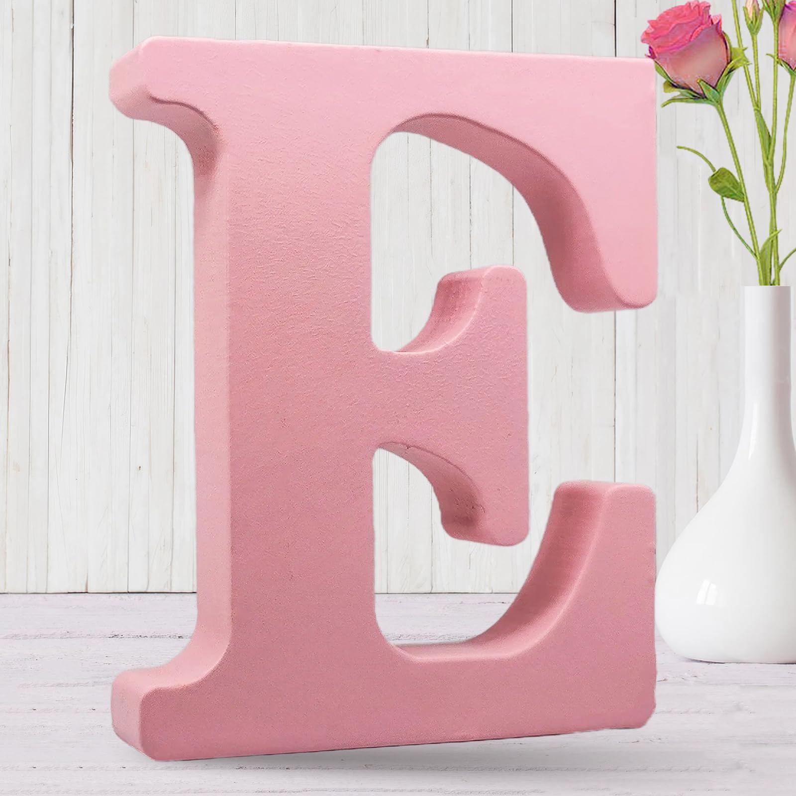 AOCEAN 8-inch pink wood letter on desk for personalized name displays.