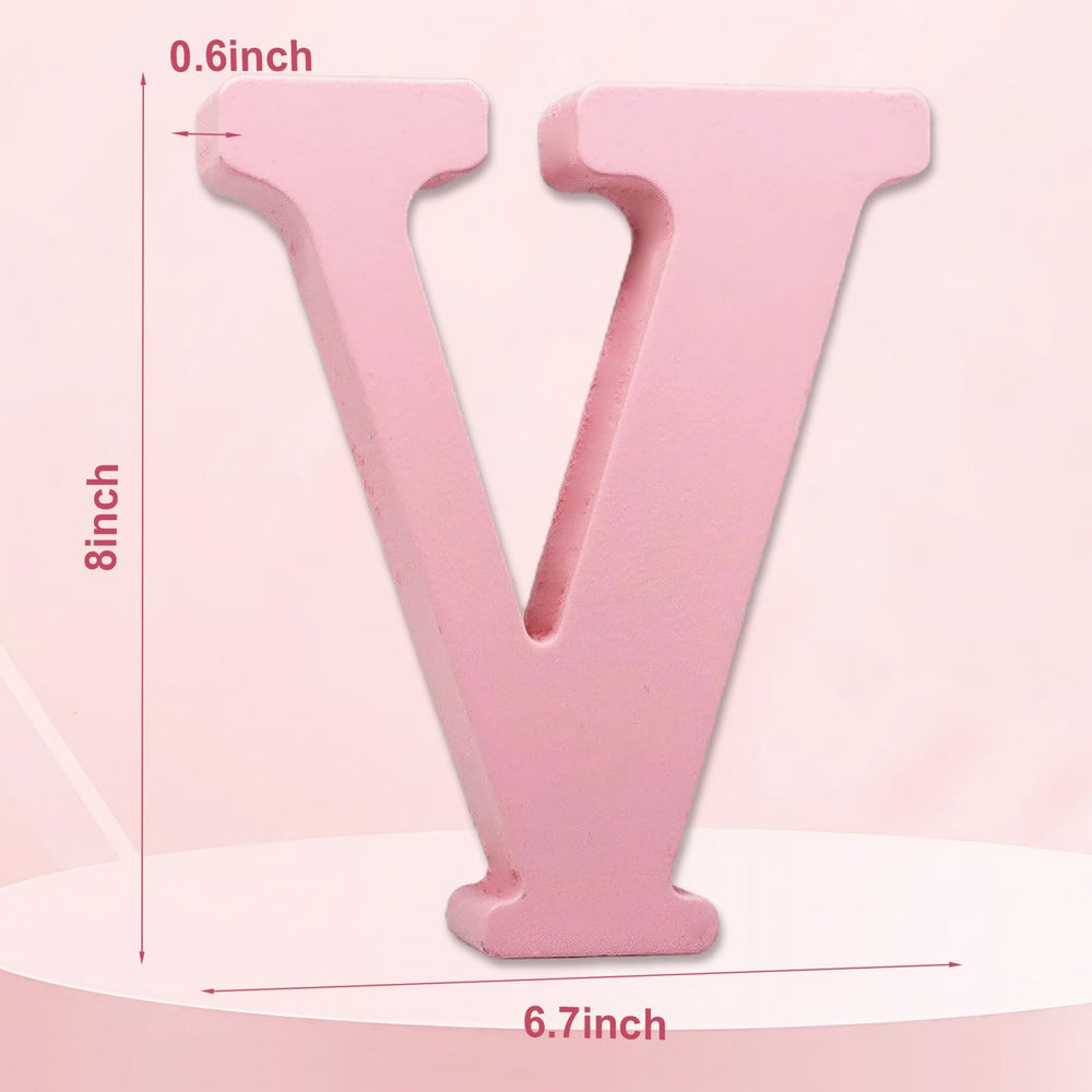 AOCEAN pink wood letter on desk ready to spell names.