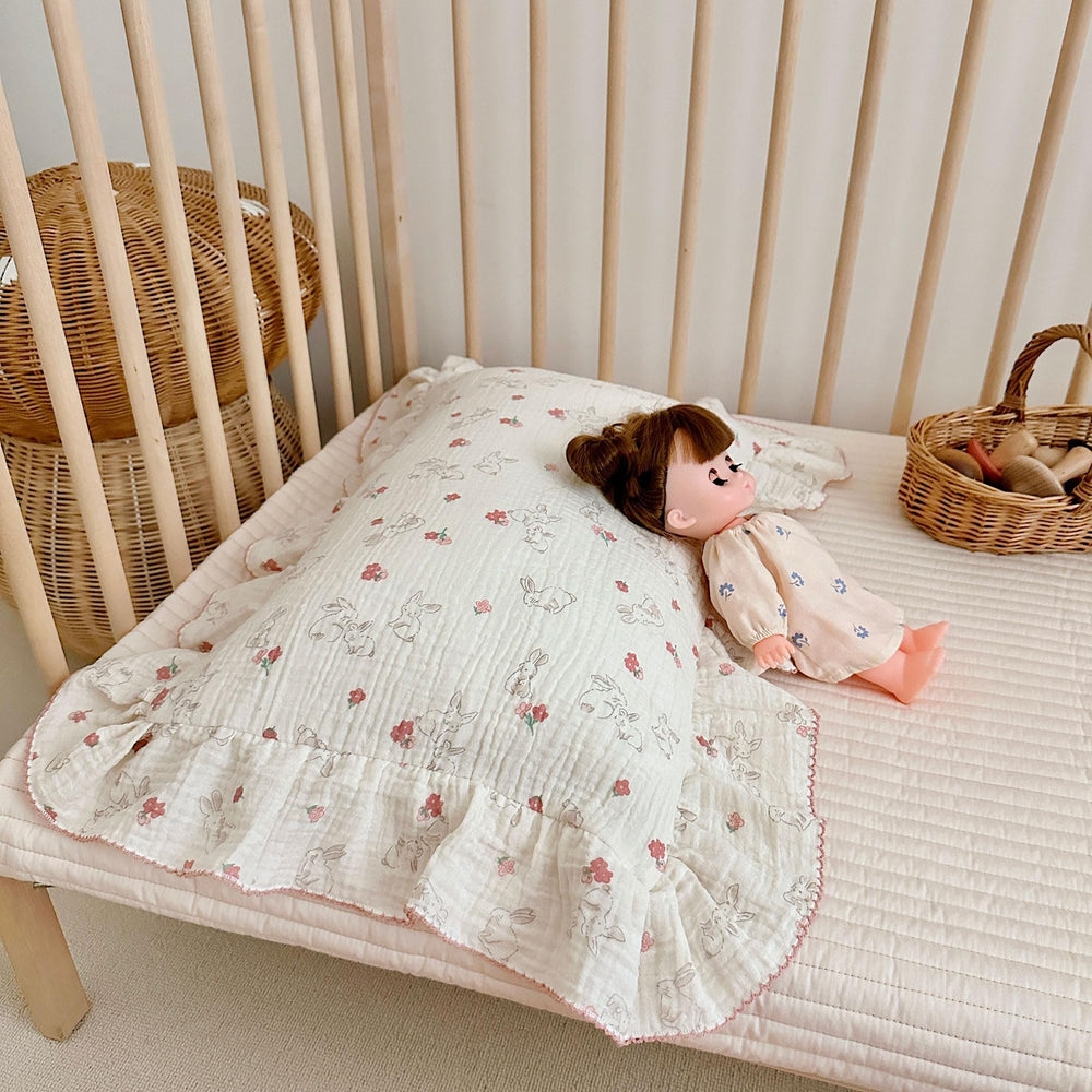 AOJIM pillowcase on crib display with floral rabbit pattern adds cozy nursery charm.
