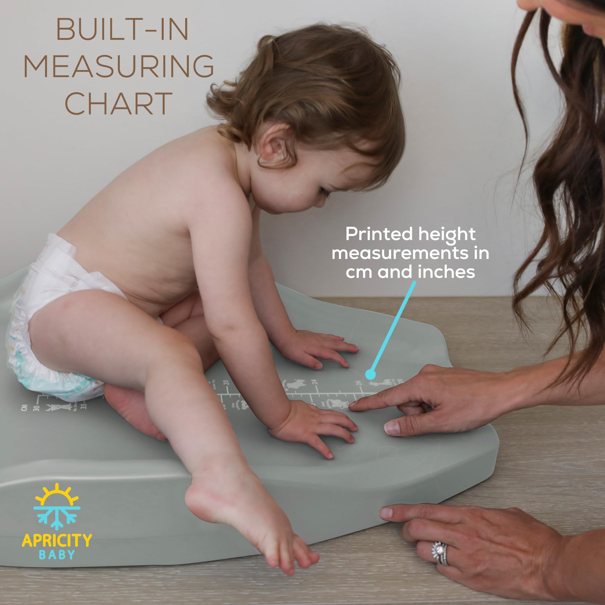 Apricity Baby Diaper Changing Pad non-slip base stays secure on a dresser.