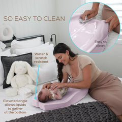 Apricity Baby changing pad with raised sides for secure, calmer diaper changes.