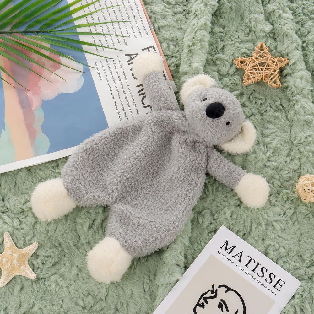 Apricot Lamb koala security blanket shown in nursery decor and cuddle