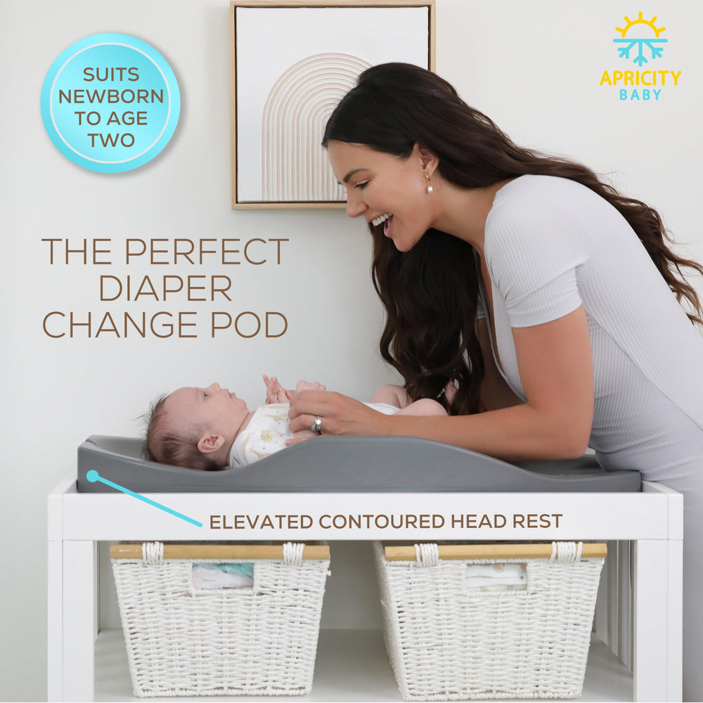 Apricity Baby diaper-changing-pad growth chart tracks height during changes.