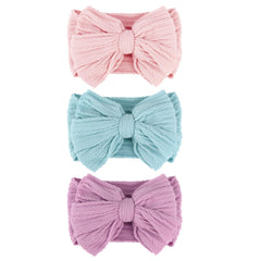 AQOKKA baby bows headband close-up showing vibrant bow for photo-ready styling.