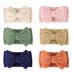 AQOKKA baby bows headband closeup showing the bow design for photos
