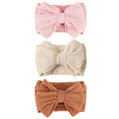 AQOKKA baby bows headbands with a big bow for adorable outfits and photos.