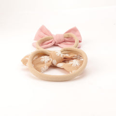 AQOKKA coral suede bow headband adds charming color without irritation.