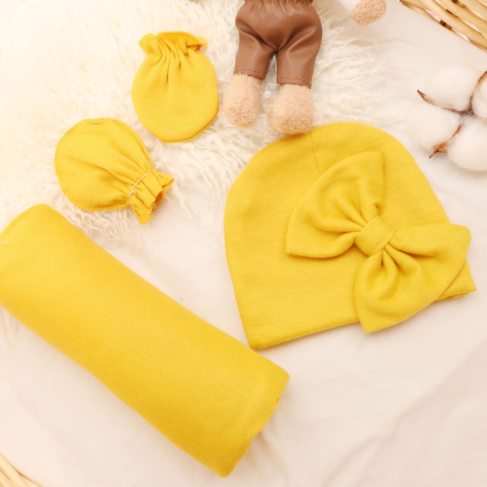 AQOKKA newborn swaddle in hospital-like setup for memorable first-day photos.