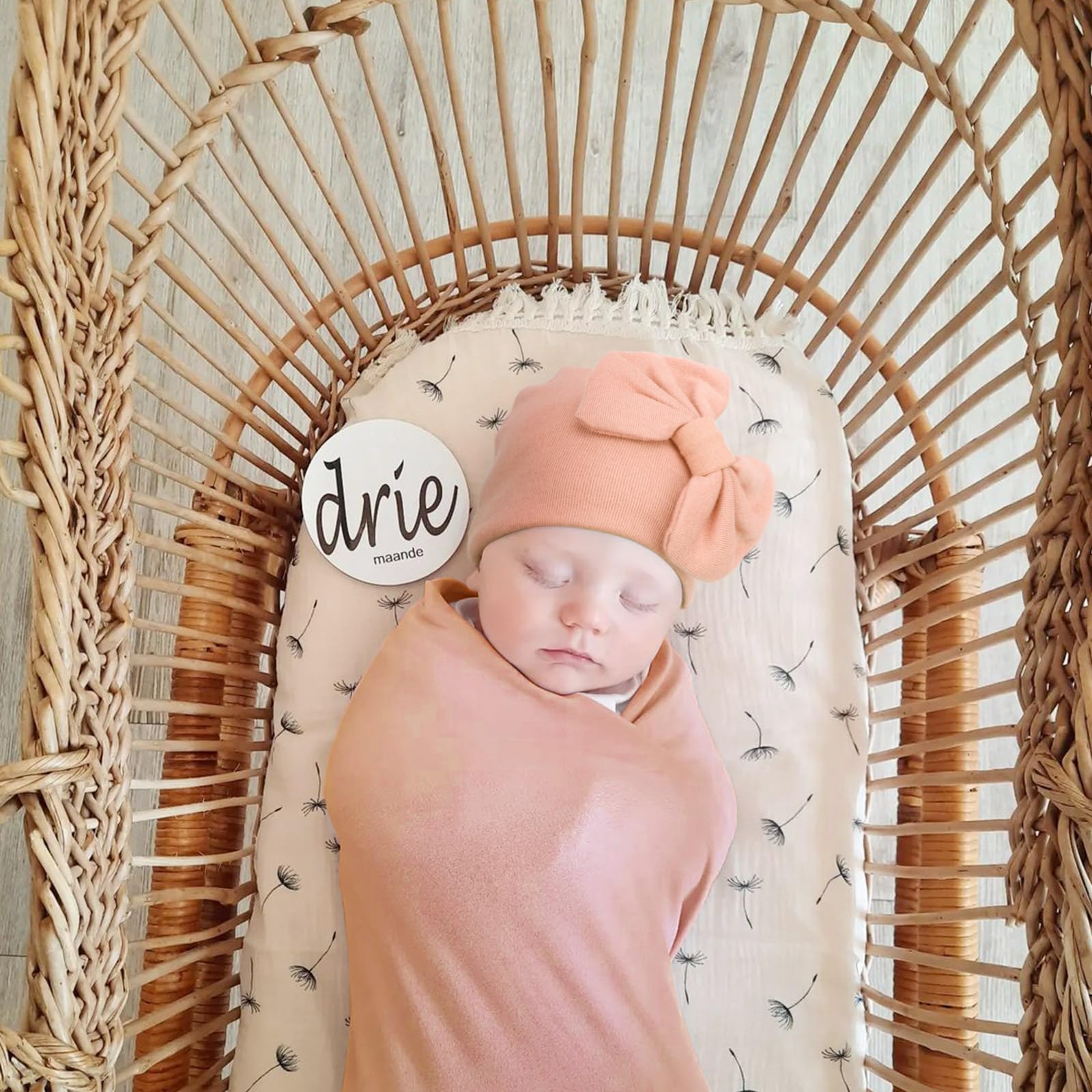 AQOKKA swaddle being used as a photo prop to capture first moments.