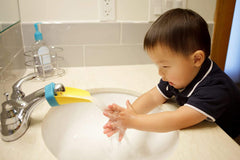 Aqueduck fits many bathroom faucets, enabling comfortable reach for kids during bath time.