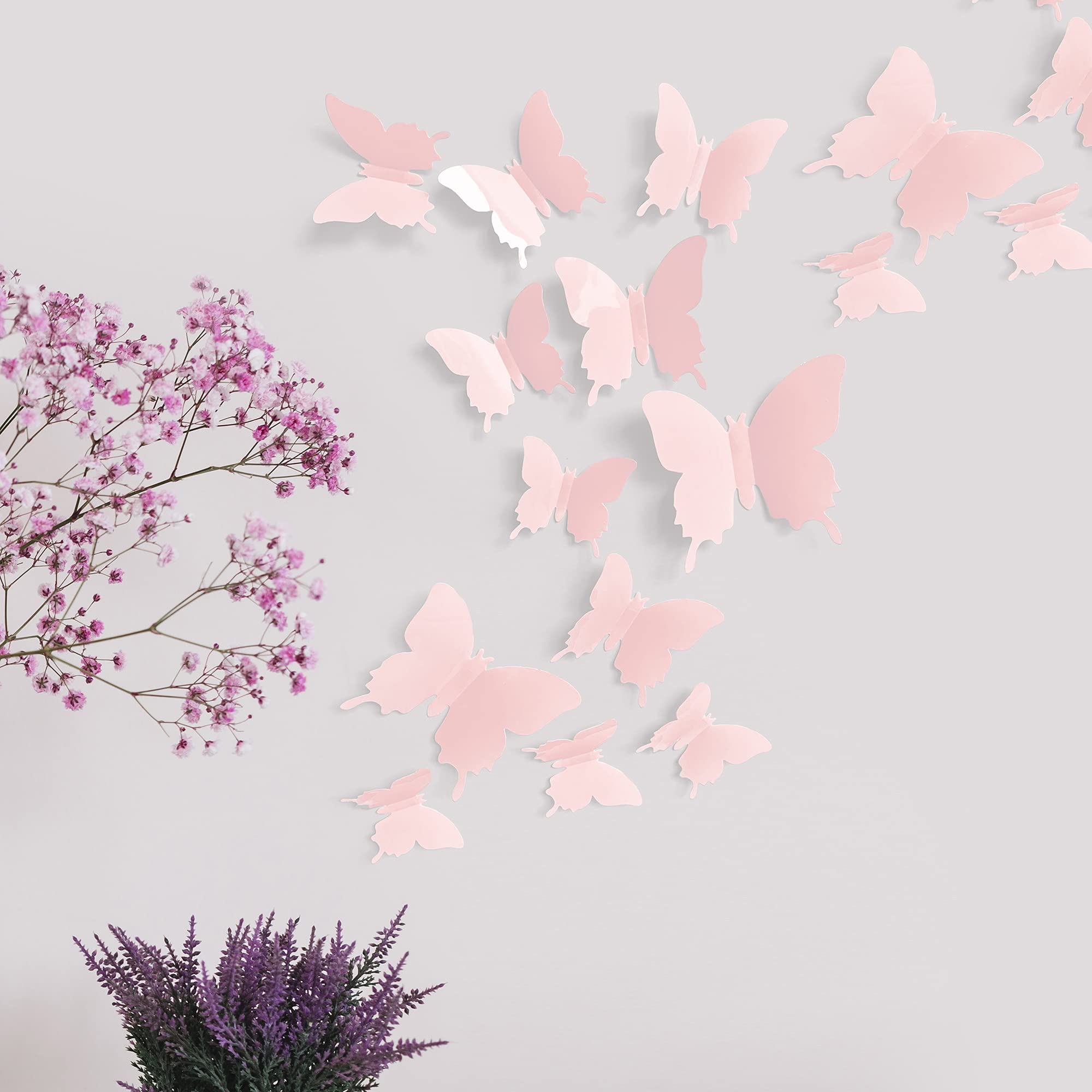 Artivo pastel pink butterflies, four sizes, easy-to-arrange for toddler room decor.