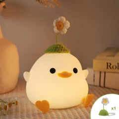 Attivolife cute duck night light with flower hat on table delivers soft ambient lighting for bedtime.