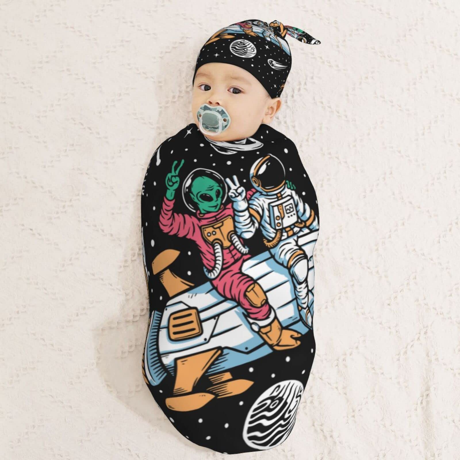 AuHomea beanie hat pairs with the swaddle for cozy head warmth.