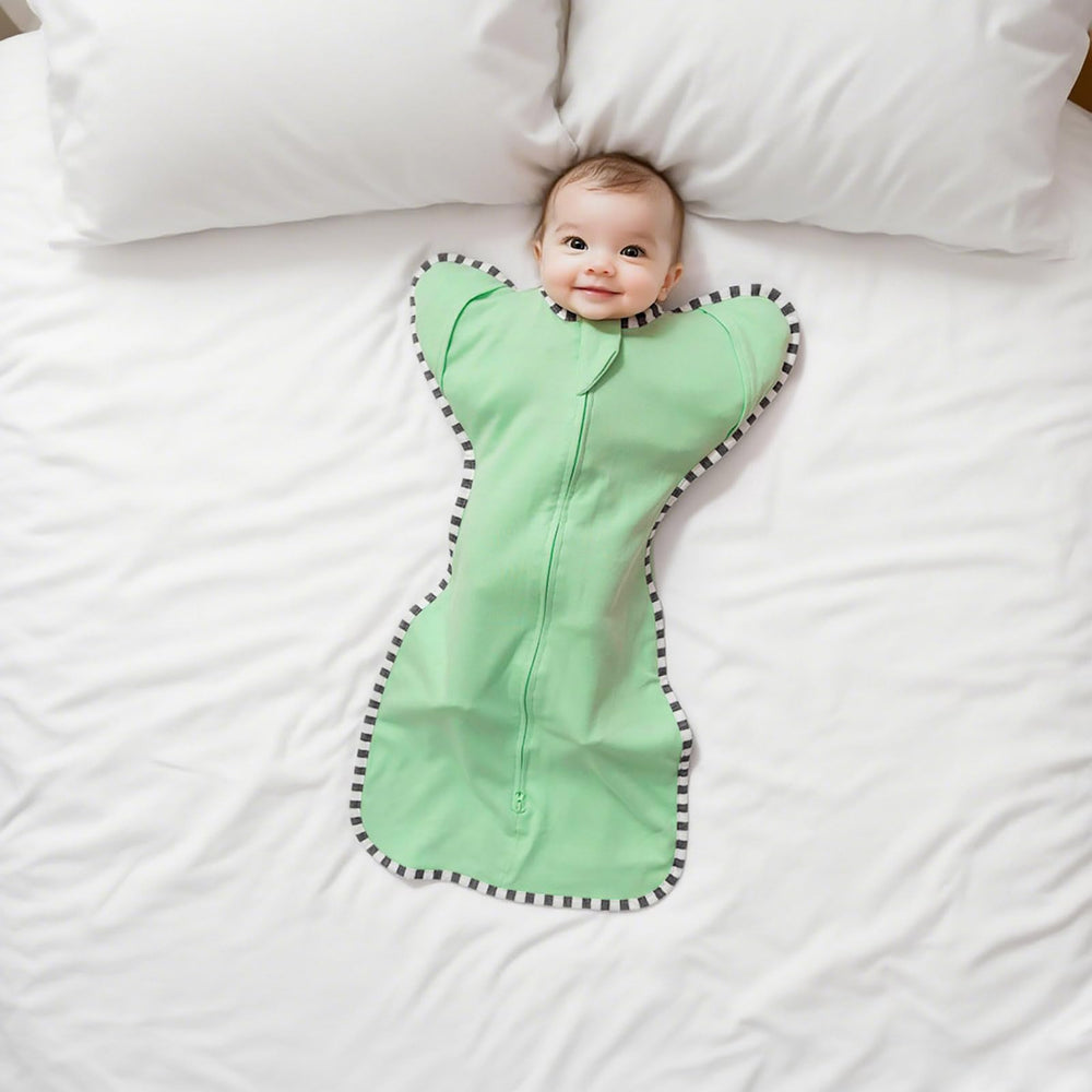 Aullar baby transition swaddle showing three-stage transition system for easy changes.