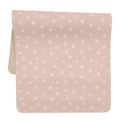 Ava + Oliver pink daisies changing mat laid flat for quick diaper changes.