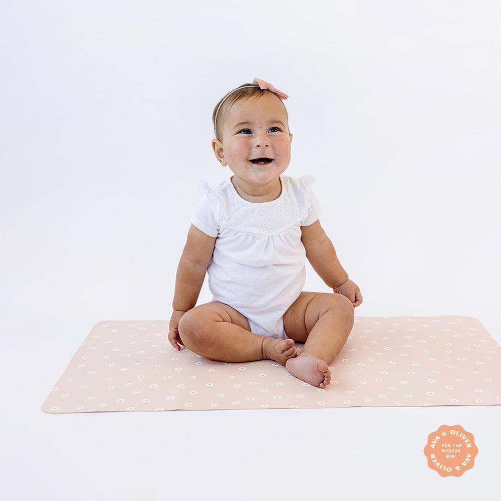 Ava + Oliver travel-friendly diaper pad ready for on the go changes.