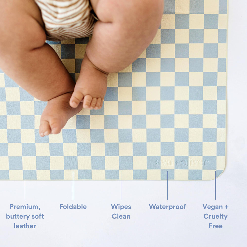 Ava + Oliver vegan leather changing mat Sky Checker portable and compact for on-the-go diaper changes.