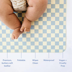 Ava + Oliver vegan leather changing mat Sky Checker portable and compact for on-the-go diaper changes.