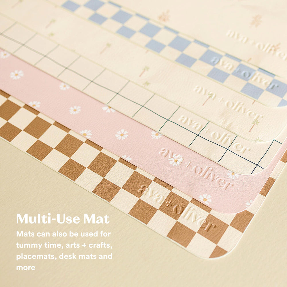 AVA + OLIVER wipe-clean vegan leather changing mat close-up for quick cleanup.