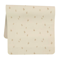 AVA + OLIVER vegan leather changing mat folded in a diaper bag for travel.