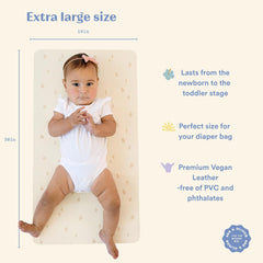 AVA + OLIVER vegan leather changing mat close-up shows soft matte texture for on-the-go changes.