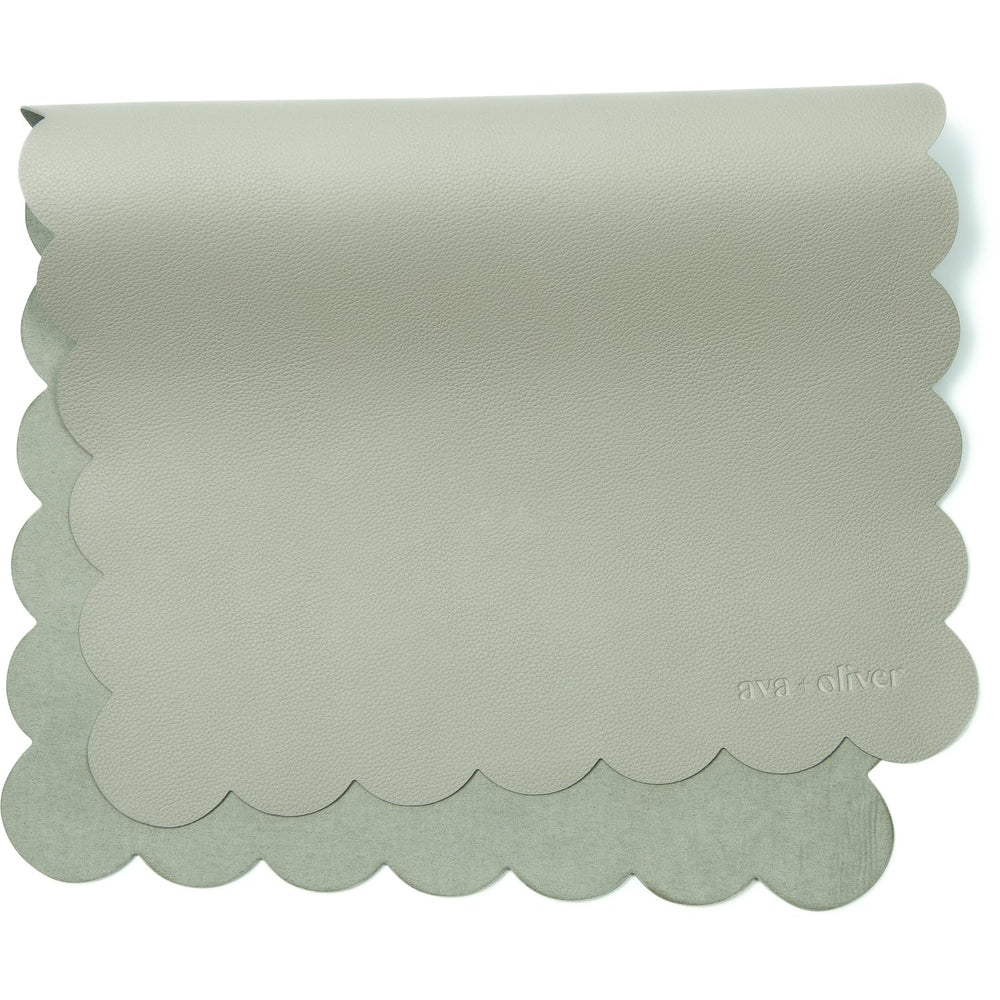 Ava + Oliver vegan leather changing mat flatlay shows durable wipe-clean surface for travel changes.