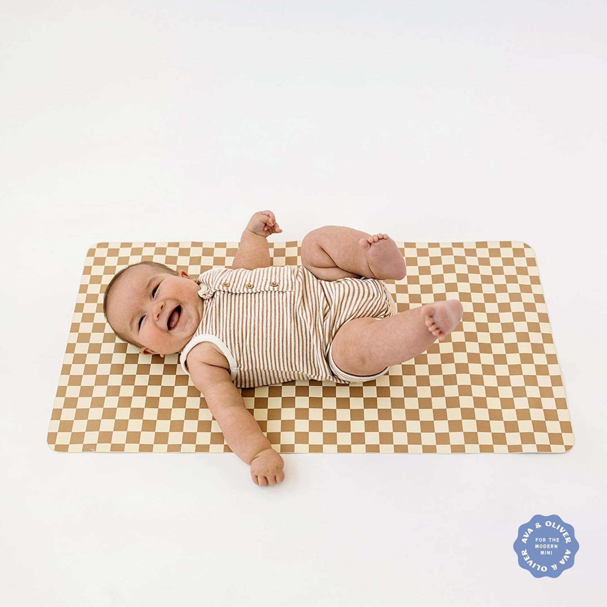 AVA + OLIVER wipe-clean changing mat cleans quickly after messy diaper changes.