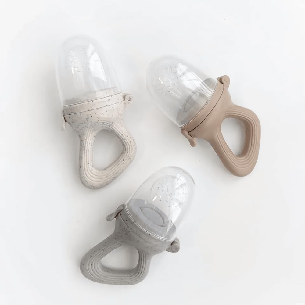 Avee & Co open-handle teething feeder beige shows easy grasp for little hands