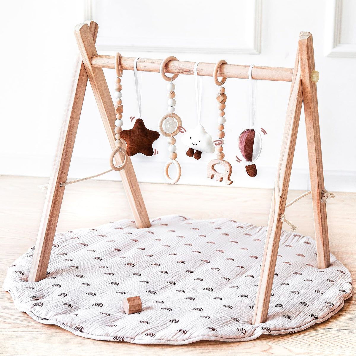 Avrsol wooden baby play gym frame promotes safe tummy time and reaching exploration.