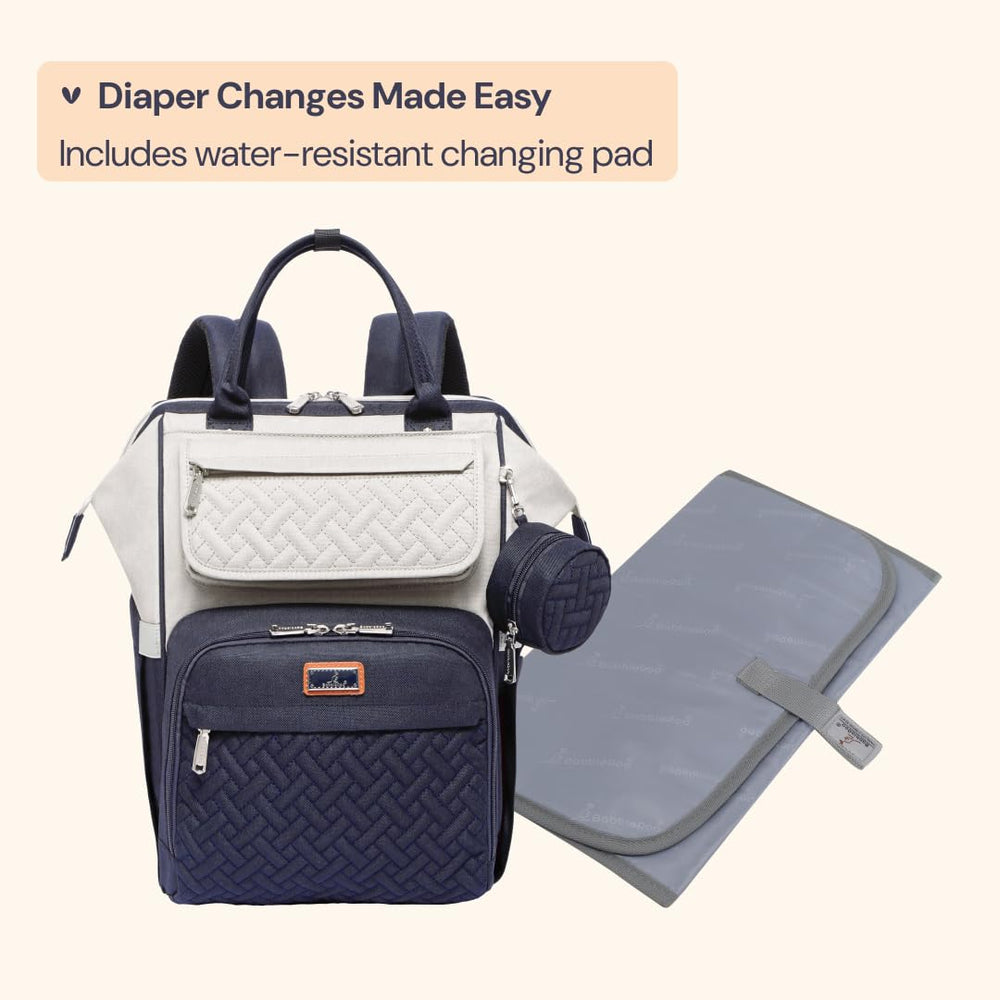 BabbleRoo diaper bag backpack cushioned shoulder straps reduce shoulder strain during travel.