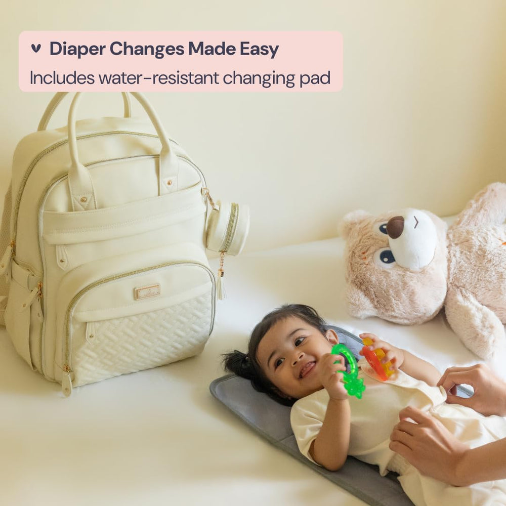 BabbleRoo Leather Diaper Bag Backpack pacifier case, organized access during outings.