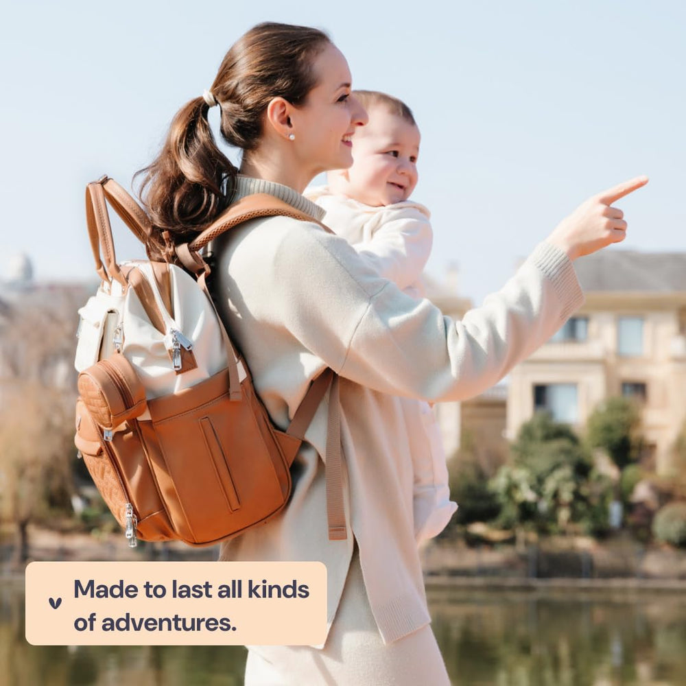 BabbleRoo caramel cream leather texture adds upscale style to practical diaper bag.