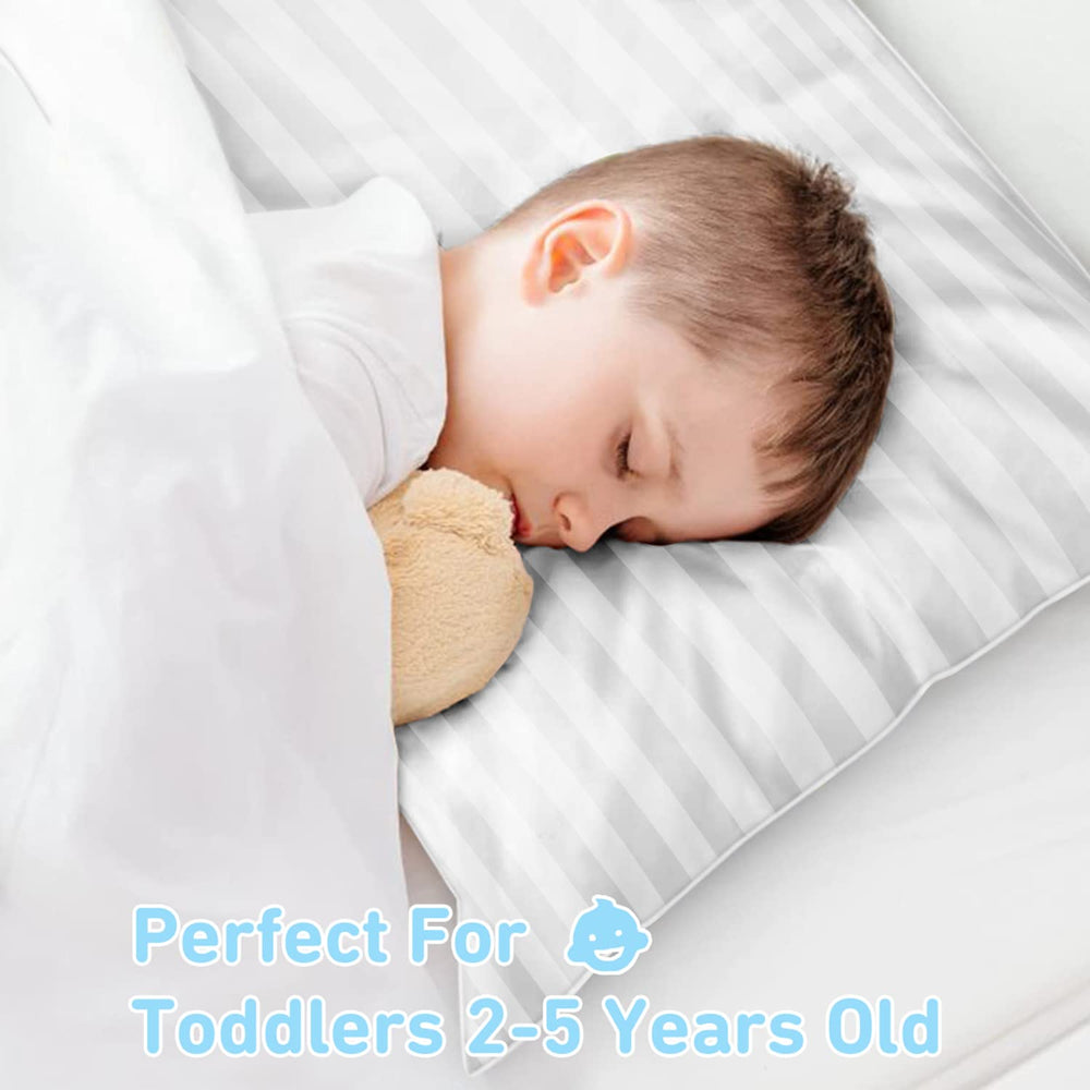 Babebay toddler pillow 13x18 on bed demonstrates cozy home sleeping companion.