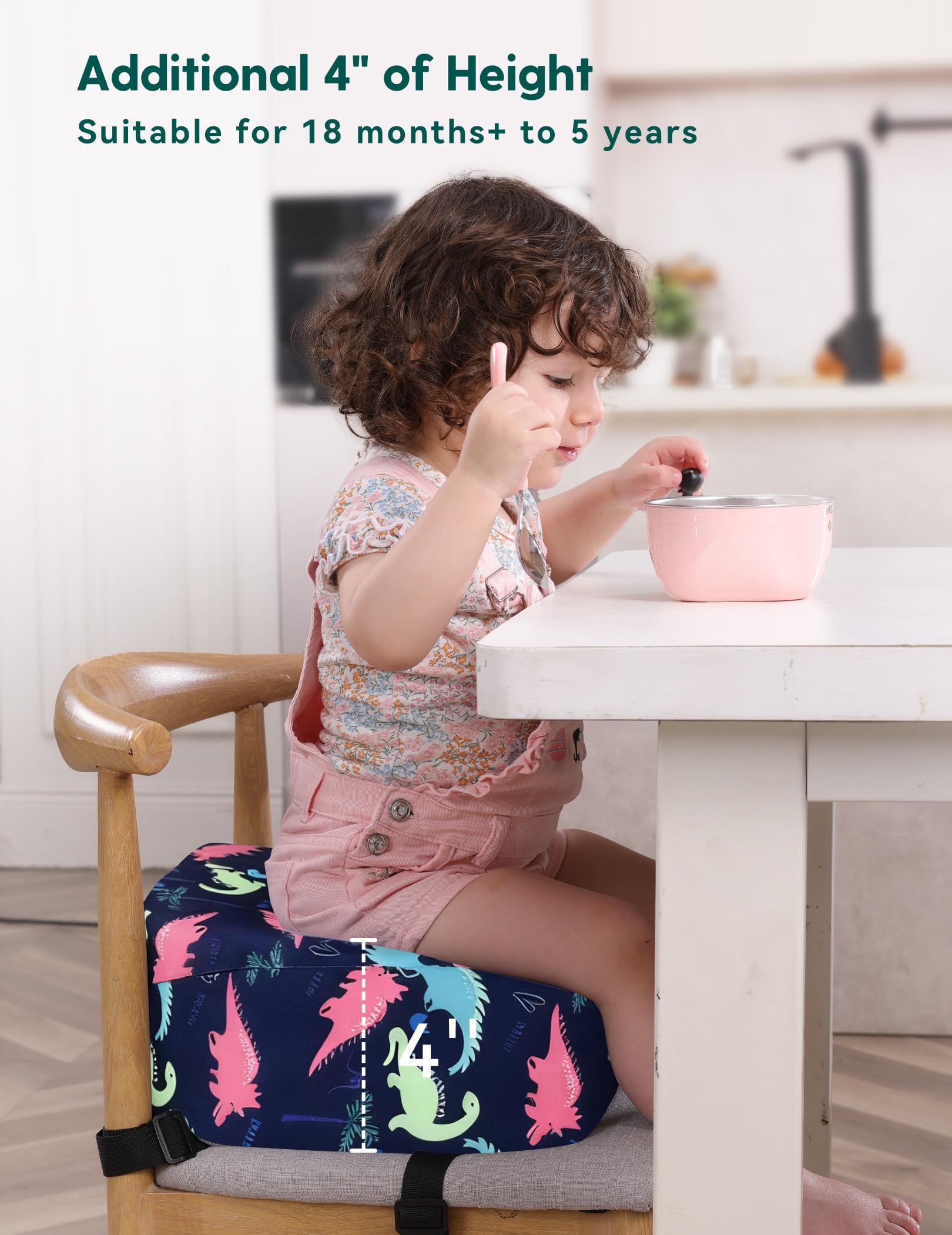 Babelio booster seat on dining table helps kids reach snacks comfortably.