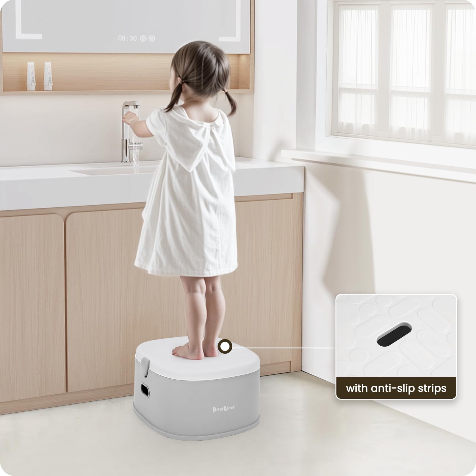 Babilous potty trainer seat with adjustable lever for standard toilets.