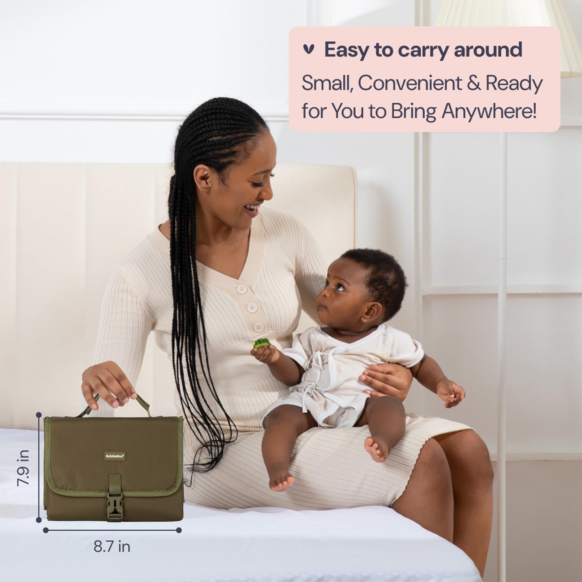 BabbleRoo army-green changing pad in a diaper bag ready for quick changes.