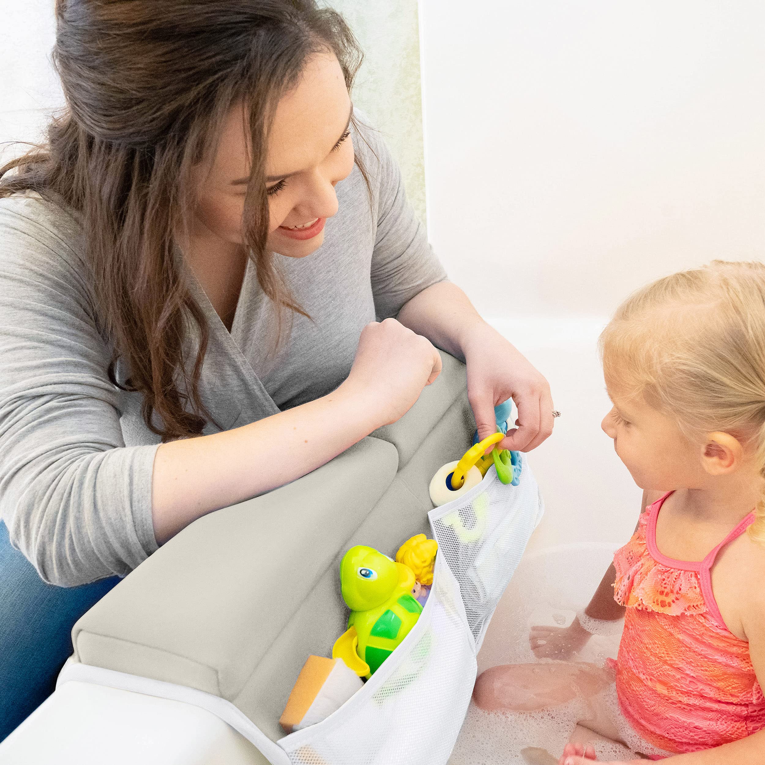 BABY BOOTH storage bag demonstrating bath toy and bottle organization
