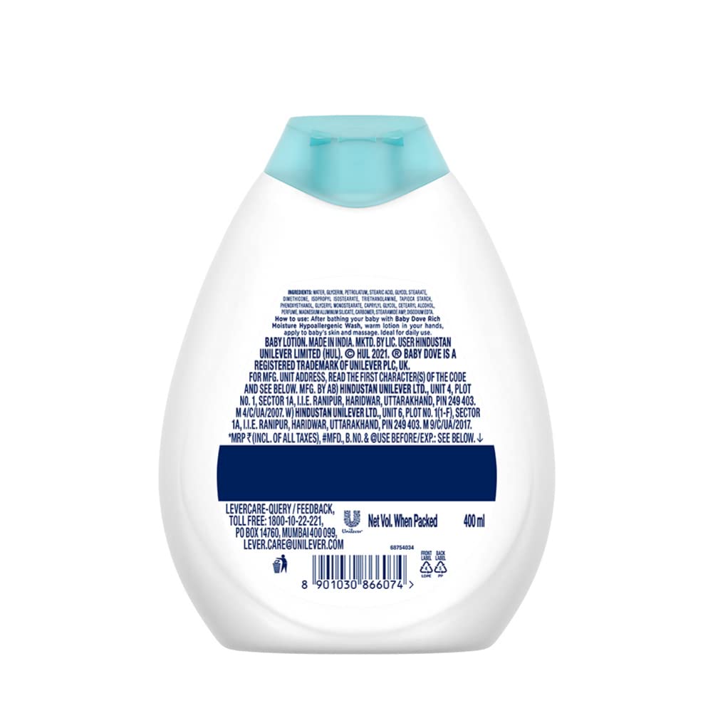 Hands applying Baby Dove Rich Moisture Lotion to moisturize baby's skin after bath.