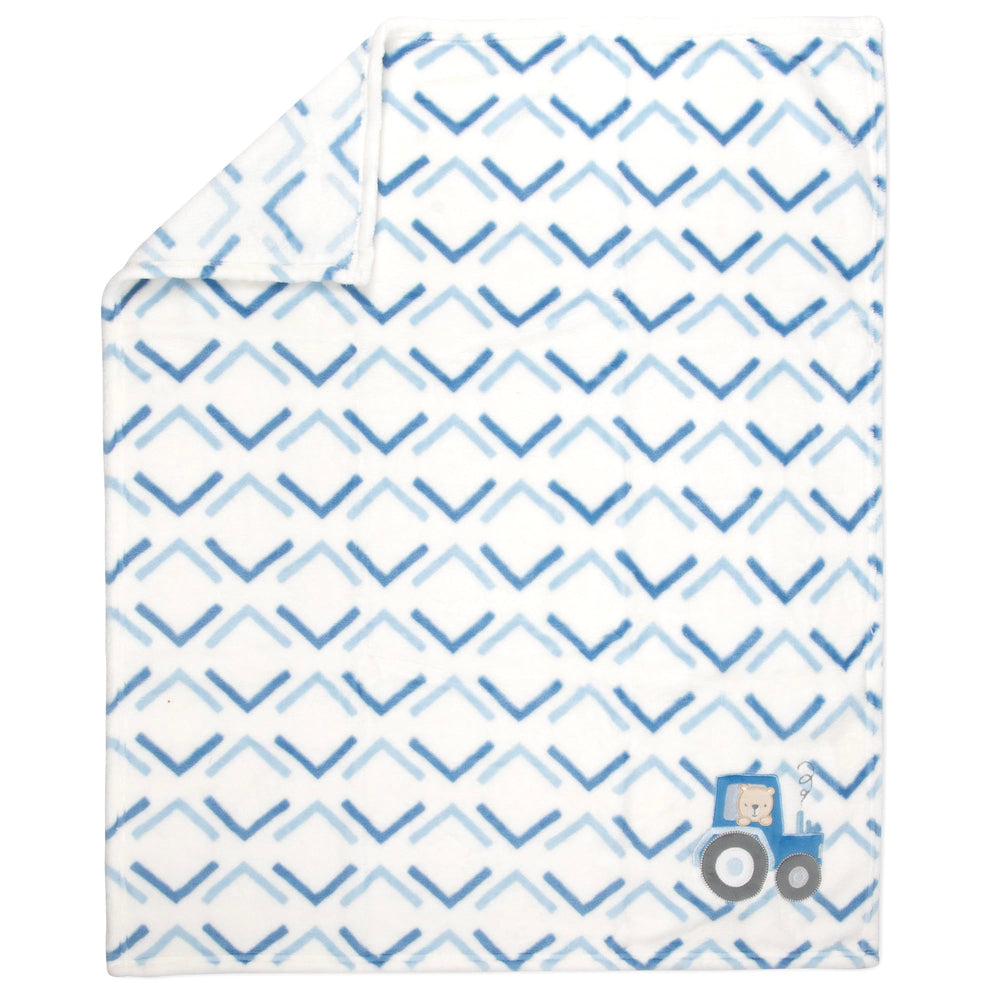 Baby Essentials embroidered character blanket adds playful detail to nursery decor.