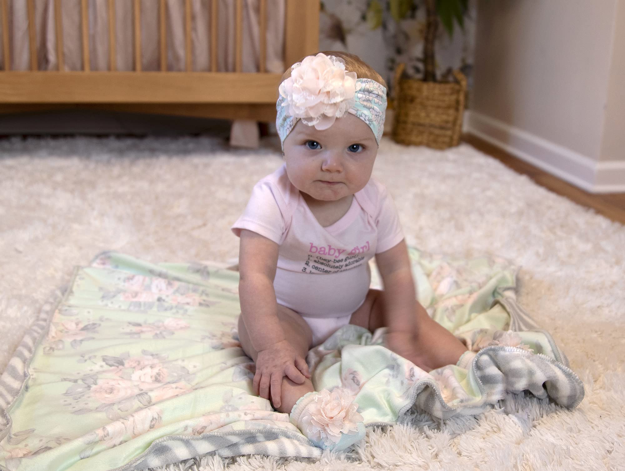 Baby Essentials sherpa blanket used as swaddle or carrier cover.
