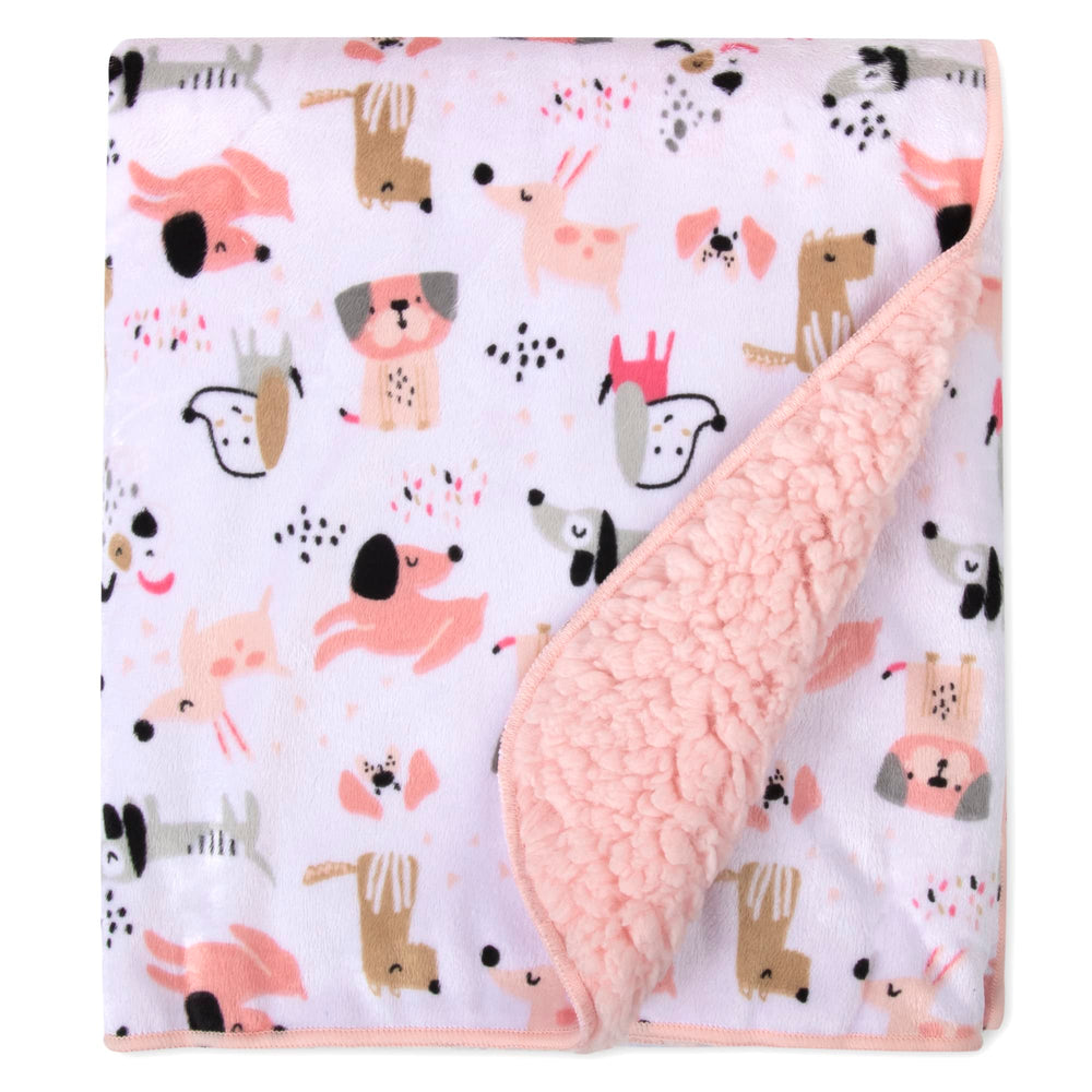 Baby Essentials Puppy Pink Sherpa blanket adds color and coziness to nursery.