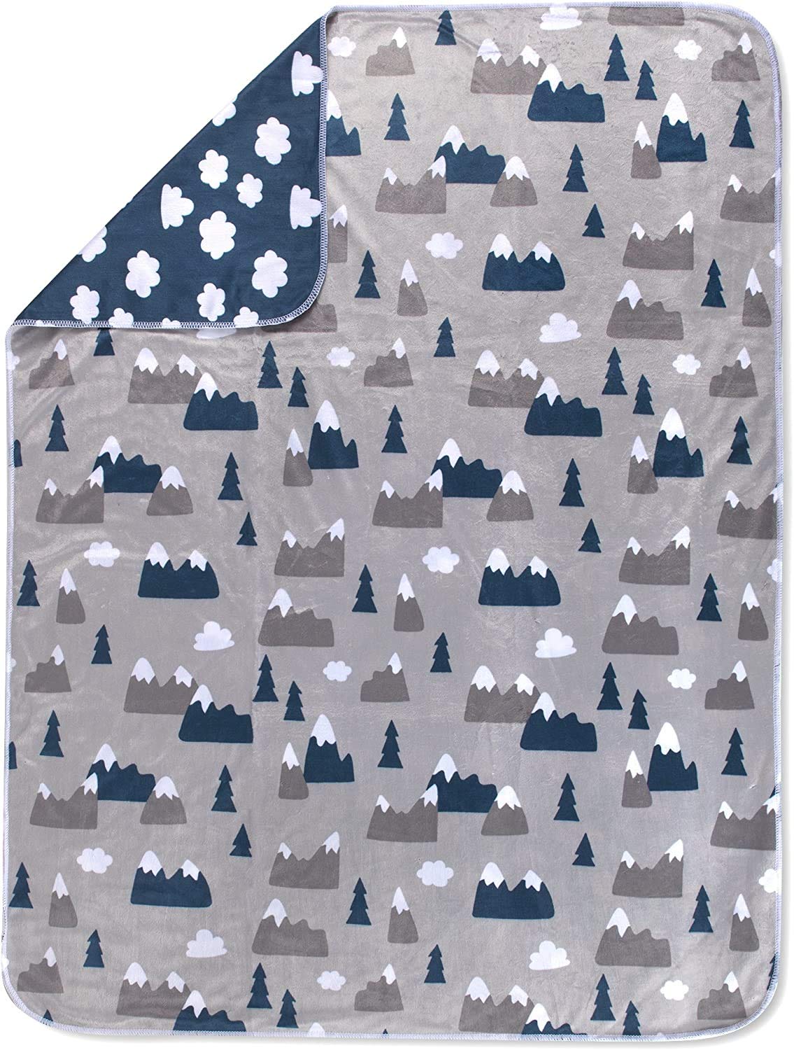 Baby Essentials snowcap mountain pattern highlights a playful nursery accent.