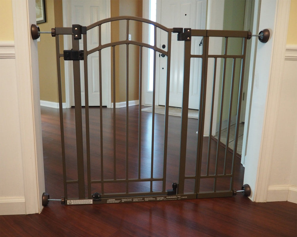 Baby Gate Guru bronze wall protector at doorway protects walls from dents