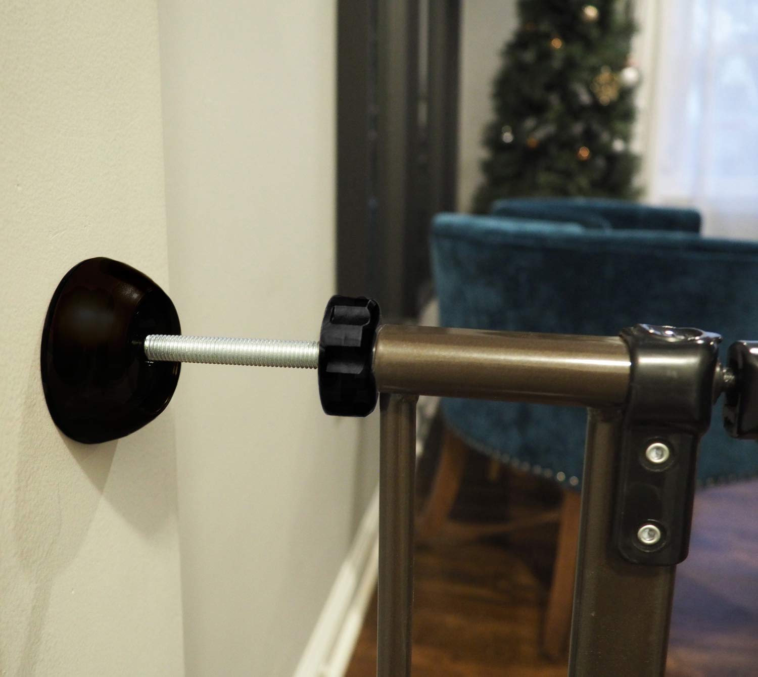 Baby Gate Guru black wall protector close-up shows non-slip cushion preventing wall scratches.