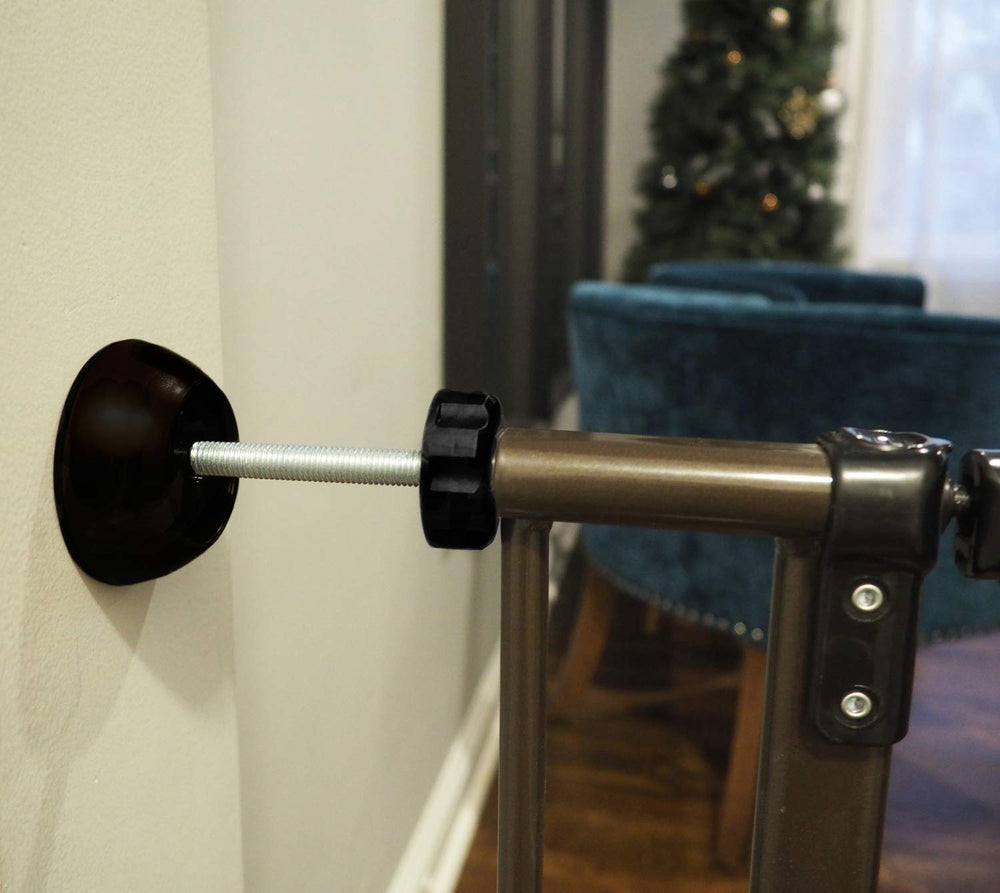 Baby Gate Guru black wall protector close-up shows non-slip cushion preventing wall scratches.
