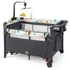 BABY JOY 5-in-1 pack and play bedside sleeper demonstrates versatile bedside setup for newborns.